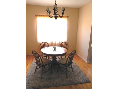 Spacious dining room featuring solid hardwood floo