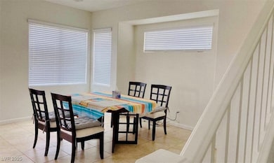 Dining room featuring light tile patterned floorin