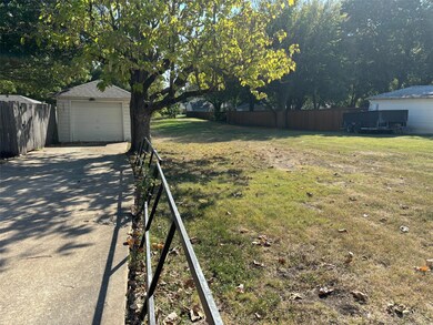 View of yard and greenbelt, park land.