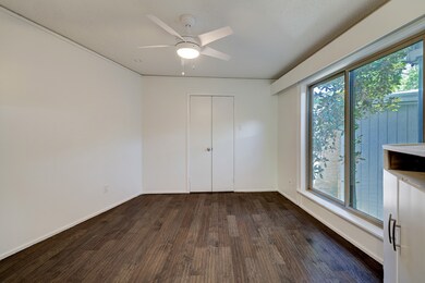 Bedroom with lots of natural light and a walk-in c