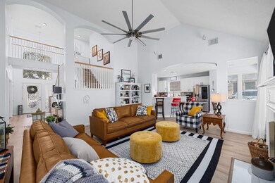 Another view of the living room as it flows into the kitchen.