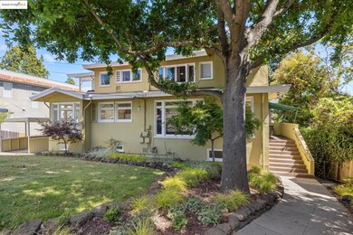 View of front of home featuring stucco siding and stairway