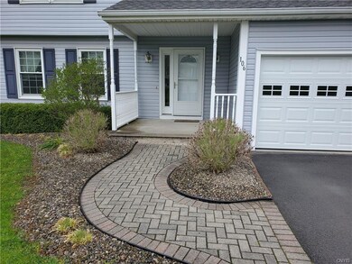 Brick walkway greets you.  Open front porch. Garag