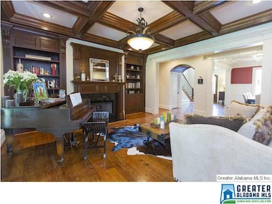 Formal Living Room with Built-In Wood Bookcases an