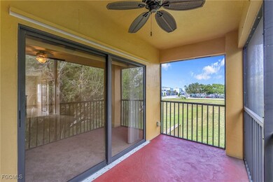 Unfurnished sunroom featuring a ceiling fan and a balcony