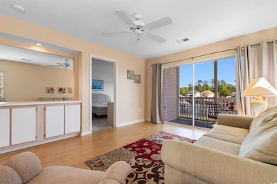 Living area with light wood-style flooring, ceilin