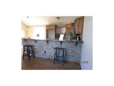 STONE ACCENT TO GRANITE BAR AREA
