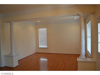 Living Room - Beautiful hardwoods & columns!