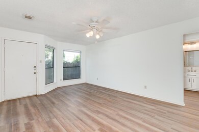 Spare room featuring light wood-style floors, a c