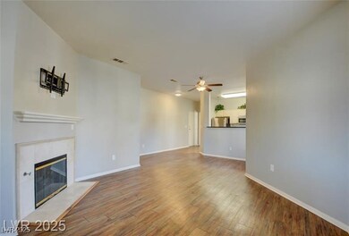Unfurnished living room featuring wood finished fl