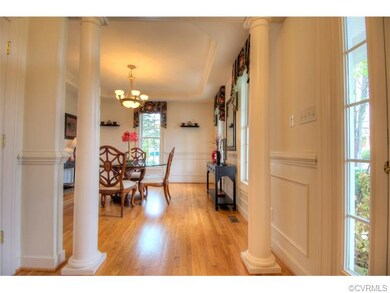 Looking into formal Dining Room through columns