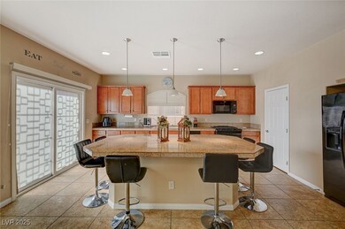 Kitchen featuring black appliances, a kitchen isla