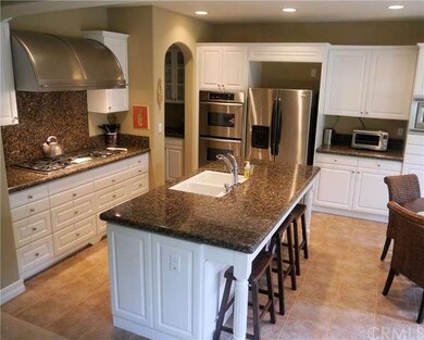 Modern kitchen with center island with pull up cas