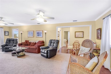 Living room with hardwood floors and dual ceiling
