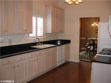 Kitchen - Spacious and light!  Entry to porch from