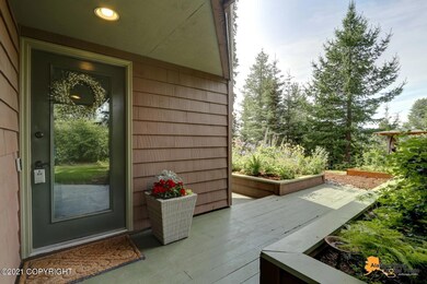 Entry surrounded by flowers