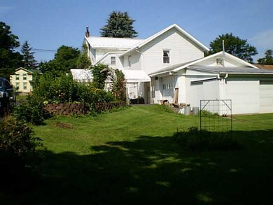 Other View of back of house shed with overhead doo