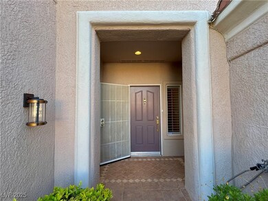 Doorway to property featuring stucco siding