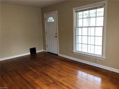 Extra large window overlooking front porch.