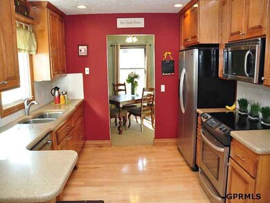 Custom maple cabinets, solid surface counters, under counter lighting, pull outs, spice rack