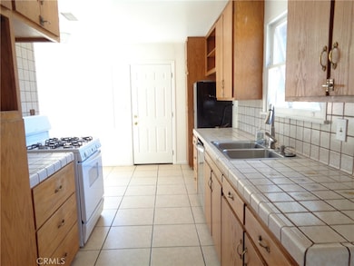 Kitchen, with Stove and Dishwasher, looking towards eating area.