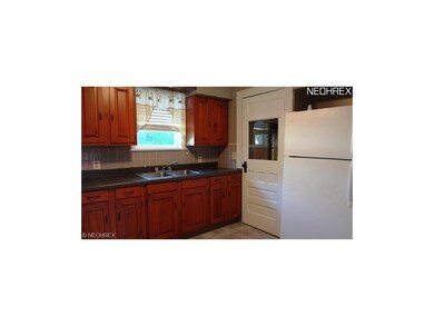 Kitchen has nice cabinets