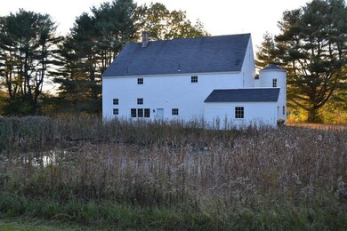 Side of the Barn with a private Pond