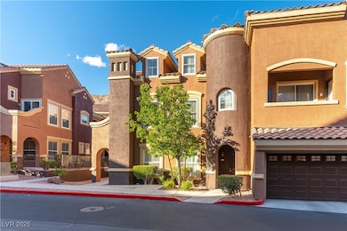 View of front of house with stucco siding, a tiled roof, and a residential view