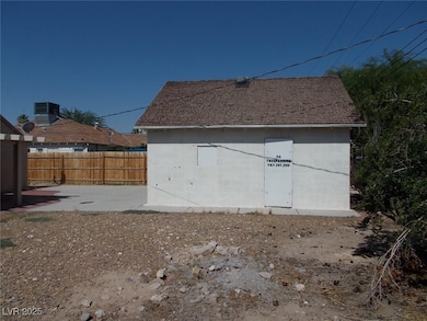 Back of house featuring a patio, concrete block si