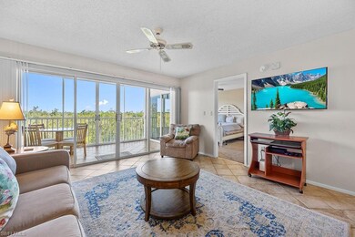 Living room with a textured ceiling, ceiling fan, 
