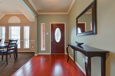 Foyer has gorgeous crown molding.