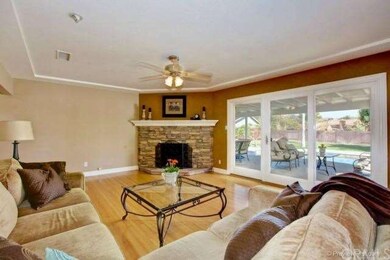 The living room features a gorgeous curved firepla