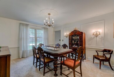 Large Dining Room with trim details, chandelier an