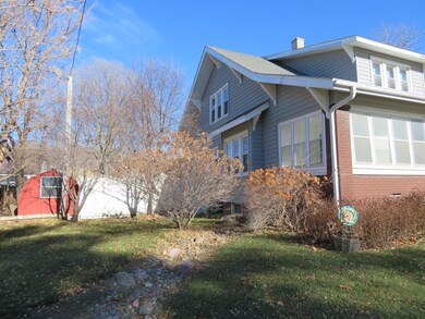 side of home, fenced in back yard