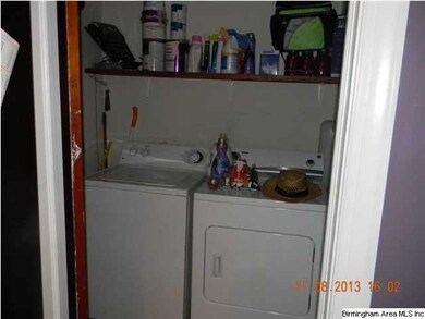 Laundry room with shelving