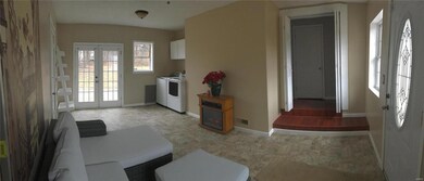 Large family room opens to the stamped concrete patio in rear.