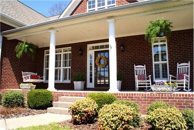 Large front covered porch ready for cozy furniture.