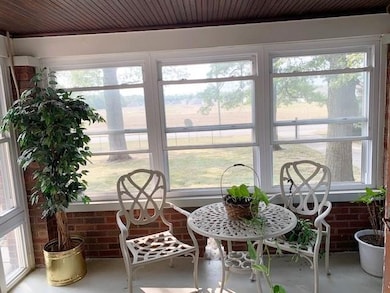 Front glass enclosed patio.