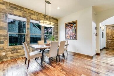 Dining room featuring light wood-style floors, ba
