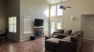 Living area featuring a wood stove, dark wood-styl