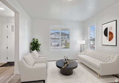 Sitting room featuring baseboards and recessed lighting
