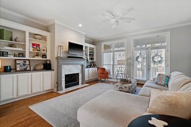 Living area featuring a fireplace, wood finished f