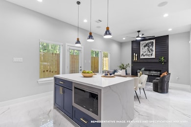 Standing at the island, you appreciate how the open view connects your kitchen to the living space, so you never miss a moment of the conversation.