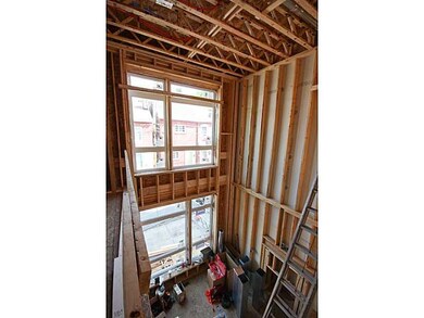 Living Room. Additional view of the two-story grea