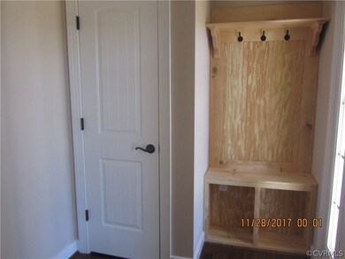 Foyer with Hall Tree and coat closet. (Hall tree t