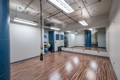 Workout area with wood-type flooring