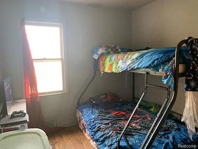 Bedroom with light wood finished floors
