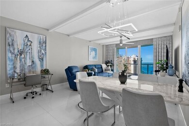 Tiled dining room featuring a water view