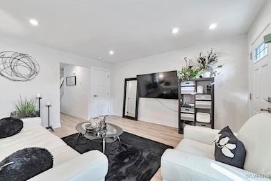 Living area featuring wood finished floors and rec