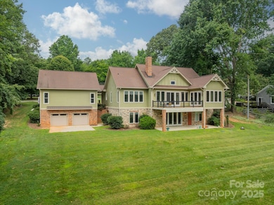 YES - LARGE 2-car garage from the BACK, TOO ... lawn equipment, extra boat/skis, collector cars - whatever YOU need to have here!